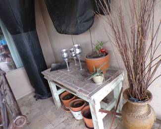 Vintage outdoor potting bench, covered outdoor heater.