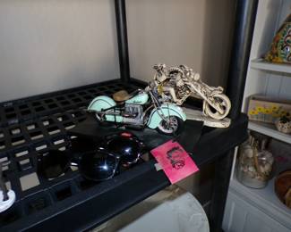 Indian motorcycle model and Ghostrider sculpture.