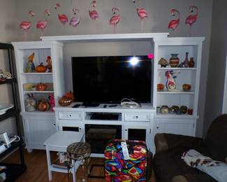 Large TV. Handmade metal flamingos.