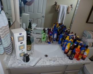 Various sunscreen and tanning oil. Bathroom items
