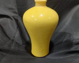 Monochrome Yellow-Glazed Vase
Qing Dynasty, late period
19th century (circa late Qing)
Origin
China

Description
Baluster-form pottery vase with rounded shoulders, tapering foot, and short cylindrical neck, covered in an even monochrome yellow glaze. The saturated yellow surface displays subtle tonal variation and soft depth characteristic of late Qing monochrome wares inspired by earlier imperial palettes. The vessel is potted in a pottery body rather than porcelain, consistent with late Qing decorative production intended for domestic or scholarly interiors. 