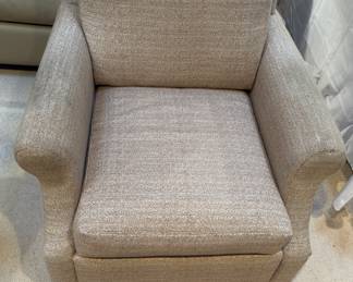 Upholstered swivel club chairs