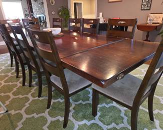 Arhaus table & 10 chairs (can be purchased but not picked up til after sale of home)