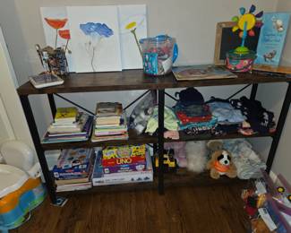 Shelf, games and children’s clothes and toys