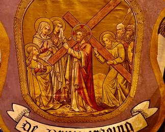 This panel illustrates a moment from the Passion of Christ, specifically Jesus carrying the cross