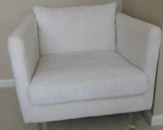 white chair with acrylic feet