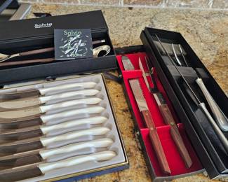 lots of plated serving utensils