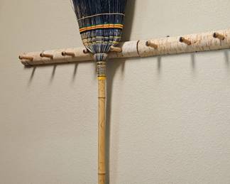 broom and wall peg