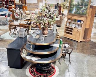 Curated Vintage Showroom with Unique Tables, Artwork, and Decorative Objects