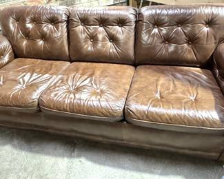 Timeless Vintage Leather Sofa with Button-Tufted Design