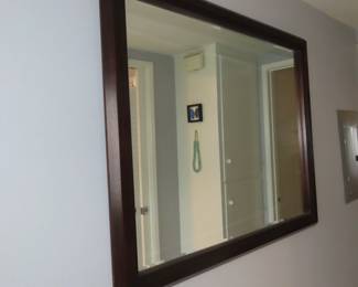 Large black framed mirror.