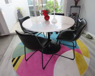 Marble top pedestal dining table and 4 leather chairs.