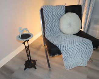 Two West Elm leather and chrome chairs.