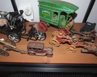 Cast iron , wagon and horses, car, cannon, fire wagon.