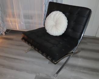 Two West Elm leather and chrome chairs.