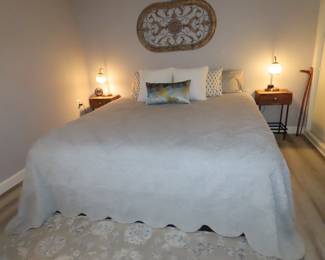 King size bed. wall art and bed linens.