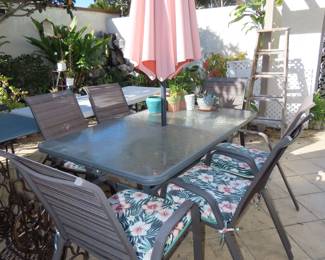 Patio table/chairs and umbrella.