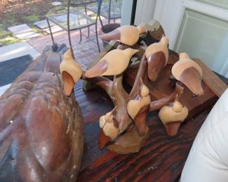 Large wooden decoys and other wood figures.