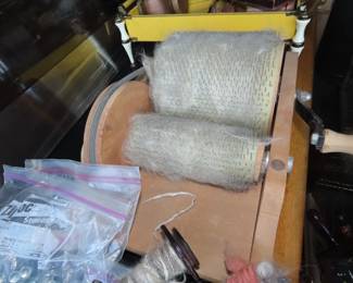 Drum carder, prepares raw fibers for spinning into yarn.