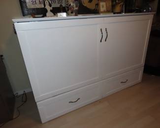 Murphy bed in cabinet.