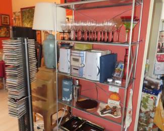 Smoked glass and chrome shelves.