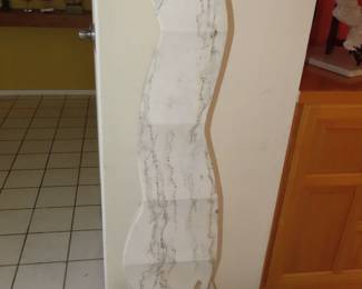 White marble sculpture with grey vein.