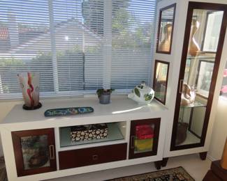 Two piece modern curio and media center.