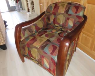 Single wooden armed chair.