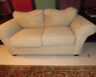 Faux suede loveseat.