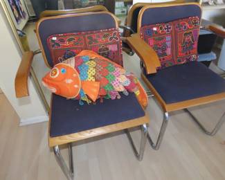 Two MCM chrome framed chairs.