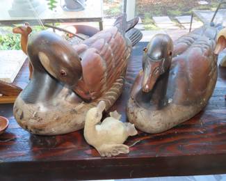 Large wooden decoys and other wood figures.