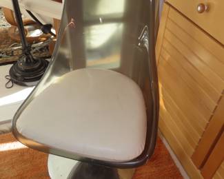 Smoked glass table with smoked plastic/fibreglass tulip chairs.