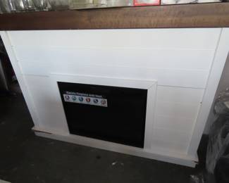 Brand new electric fireplace with mantle surround.