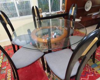 Modern round glass table and 6 chairs.
