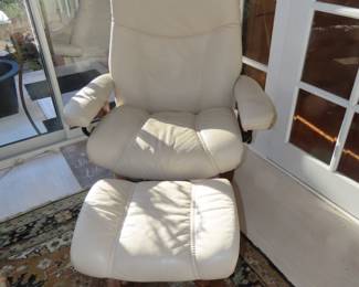 Leather push back recliner with footstool.