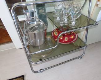 Vintage smoked glass bar cart.