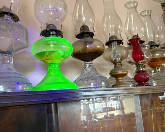 Oil lamps including uranium