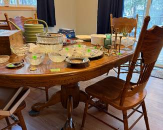 Oak table with 4 press backed chairs