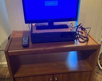 19 Element TV with Magnavox VHS Player  Wooden Colored Stand