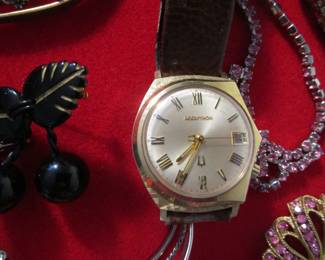 Some of the jewelry case including Accutron watch