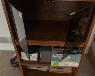 Stereo cabinet with records, including 33s and 45s. Also included is CDs and cassette tapes. . You get it all for one money.