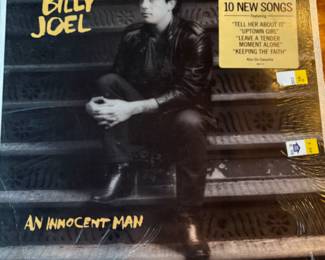 Lots of vinyl LPs, mostly rock and pop, including Beatles, Bette Midler, Stevie Wonder, Michael Jackson, Barry White, The Who, Bob Marley, Jimmy Buffet, Barbra Streisand, Wings, and more