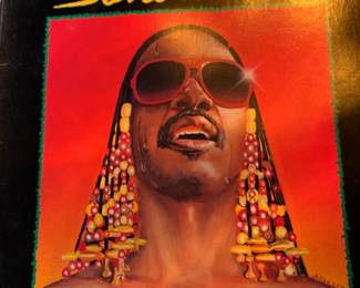 Lots of vinyl LPs, mostly rock and pop, including Beatles, Bette Midler, Stevie Wonder, Michael Jackson, Barry White, The Who, Bob Marley, Jimmy Buffet, Barbra Streisand, Wings, and more