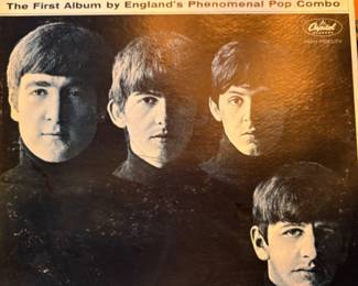 Lots of vinyl LPs, mostly rock and pop, including Beatles, Bette Midler, Stevie Wonder, Michael Jackson, Barry White, The Who, Bob Marley, Jimmy Buffet, Barbra Streisand, Wings, and more