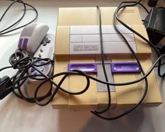 vintage Super Nintendo console with controllers