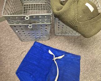 Vintage metal locker room and swimming pool baskets. Vintage swimming trunks and Red Cross vest