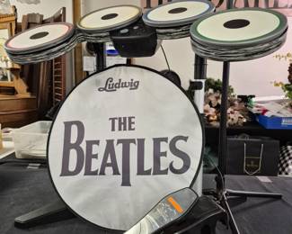 Rock Band "The Beatles" drums with sign