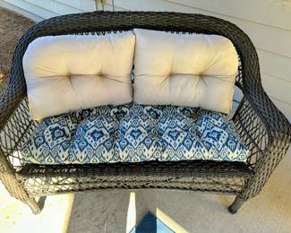 Wicker patio loveseat with cushions