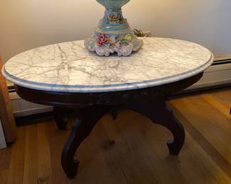 Vintage Italian heavily veined marble topped oval table