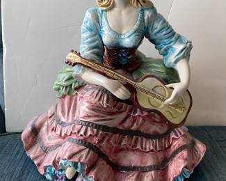 Antique Capodimonte of a Victorian lady playing guitar